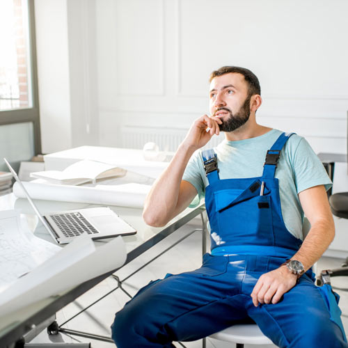 bored-HVAC-owner-at-the-office-waiting-on-phone-call